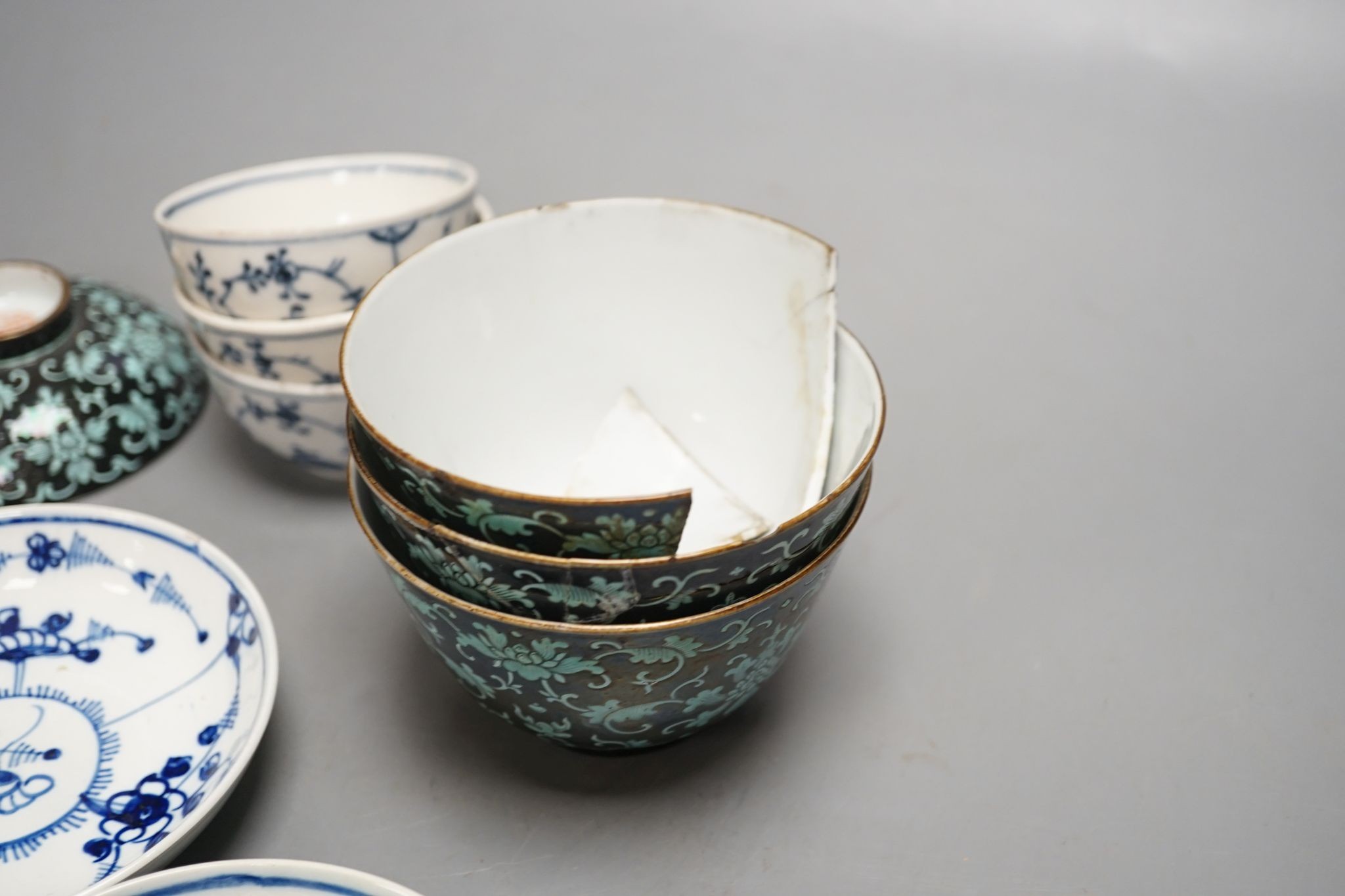 A 19th century Chinese black ground porcelain bowls and two covers, together with an three onion pattern blue and white tea bowls and saucers a/f